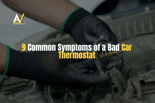 Mechanic-holding-Car-Thermostat-near-engine