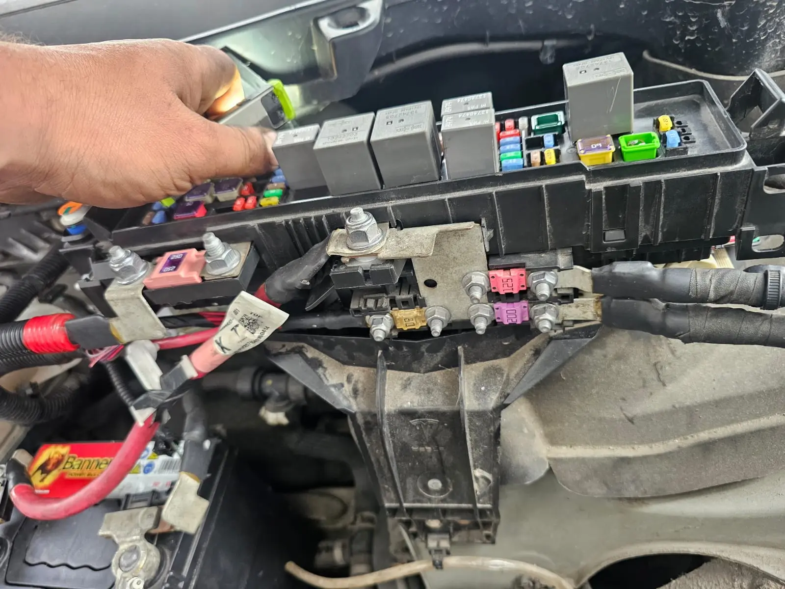 mechanic-checking-car-fuses-and-relays-during-electrical-diagnostics