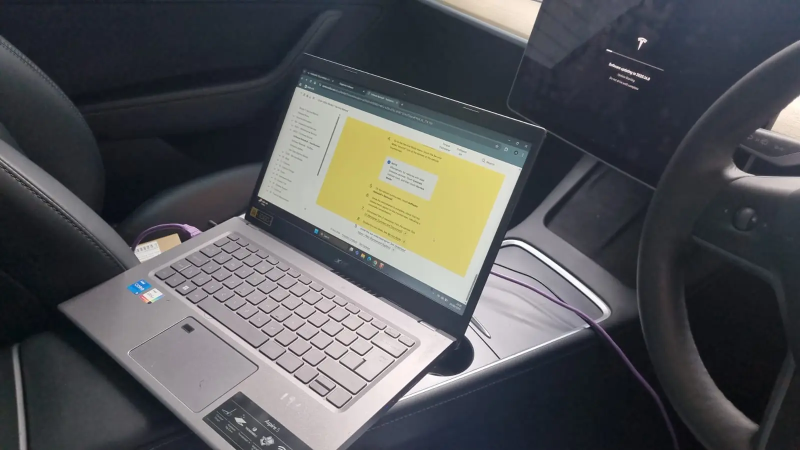 tesla-computer-diagnostic-testing-using-a-laptop-inside-the-vehicle